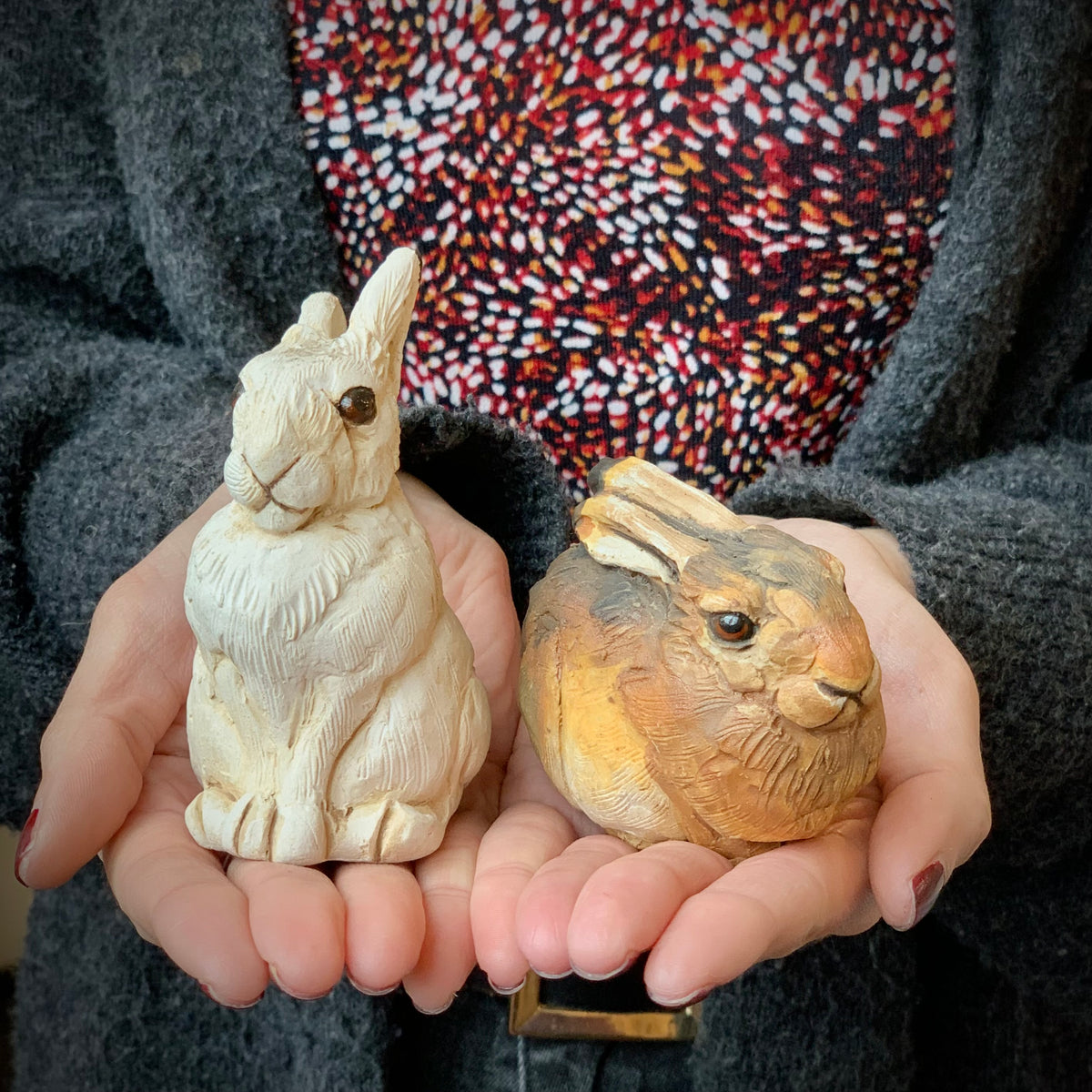 Small ceramic rabbit sculpture in brown