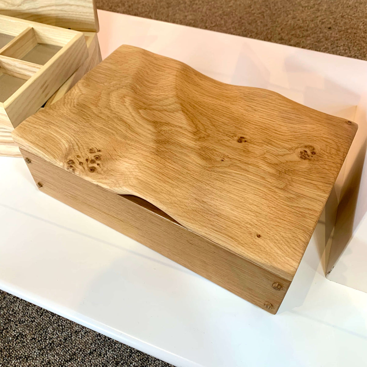 Handmade wooden jewellery box with wave design on lid, available at Ferrers Gallery.
