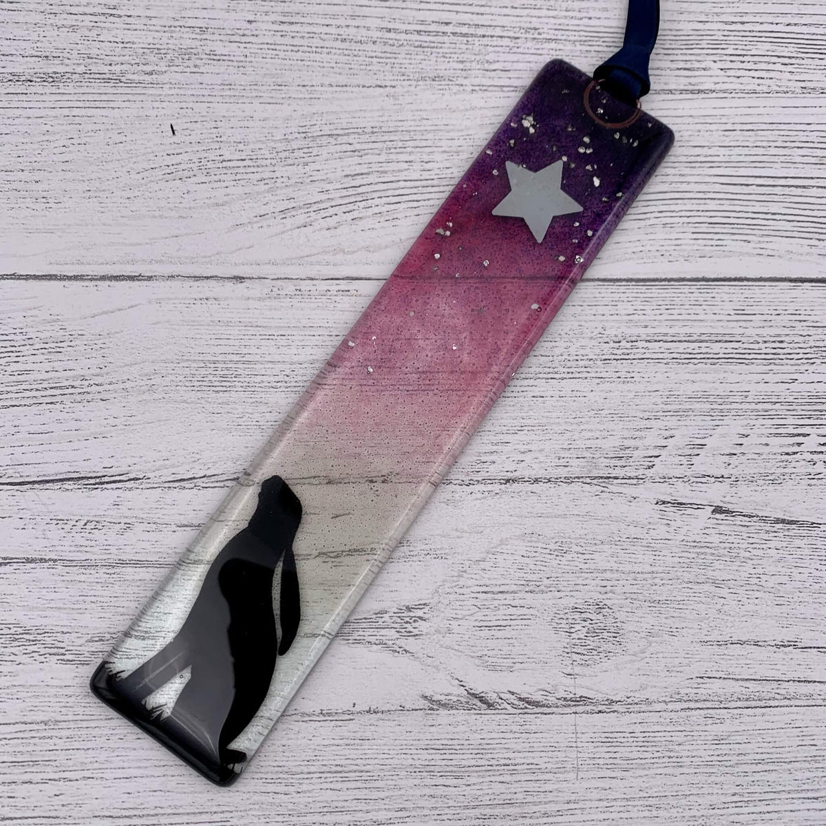 Handcrafted pink fused glass wish stick, with a star at the top and glitter.  