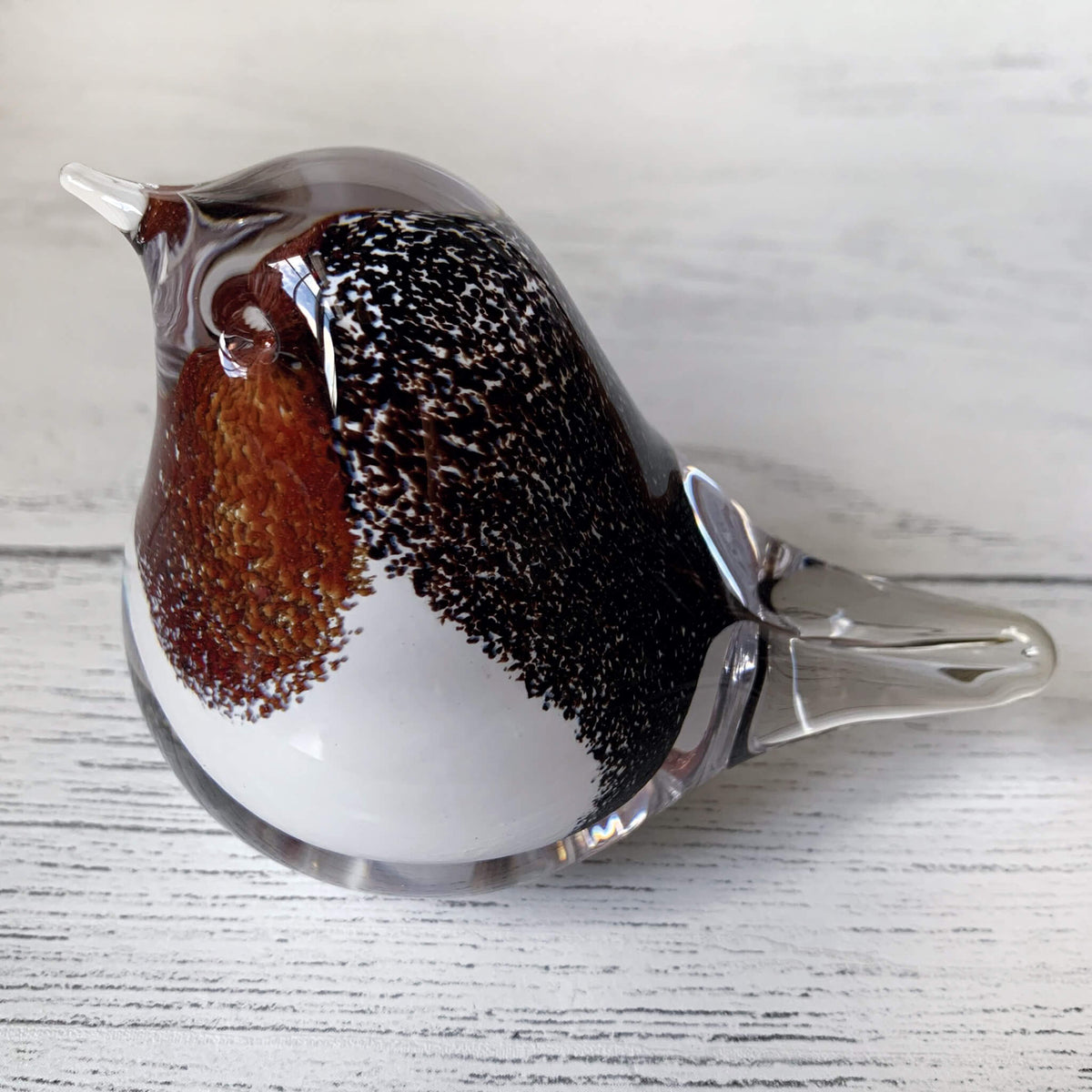 Handmade fused glass Robin ornament, with smooth glass shape and speckle details. 
