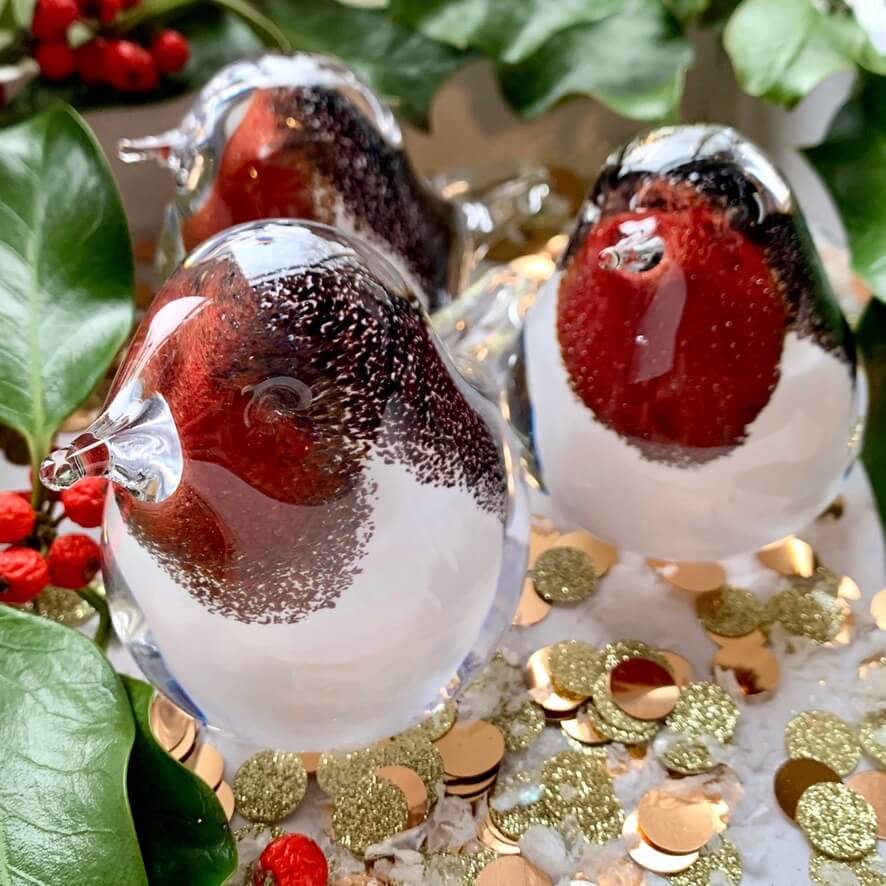 Handmade fused glass Robin ornament, with smooth glass shape and speckle details.